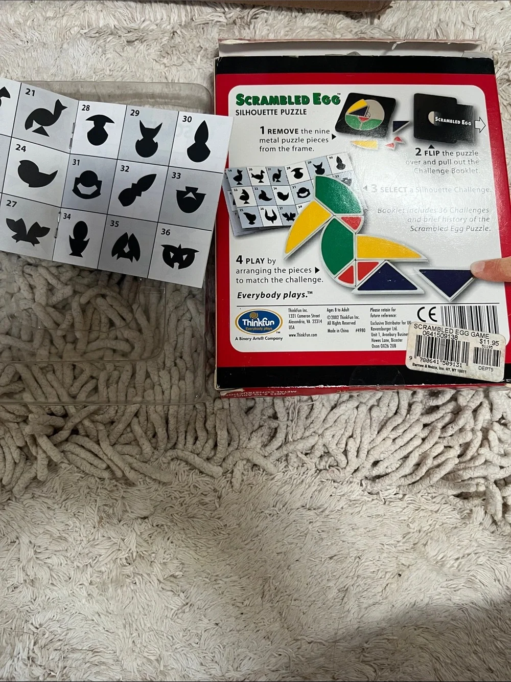 Scrambled Egg Silhouette Puzzle by ThinkFun - Red Box, Yellow/Green/Gray Pieces